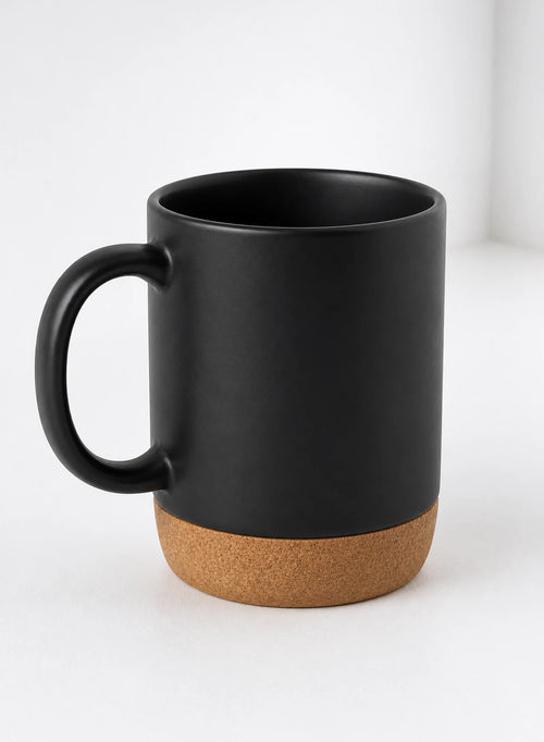 Cork Base Mug — Black, ceramic mug shown in a complementary studio setting