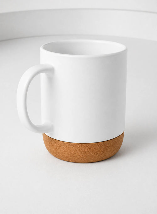 Cork Base Mug — White, ceramic mug shown in a complementary studio setting