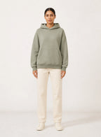 Cove Relaxed Hoodie, relaxed pullover hoodie shown in a complementary studio setting