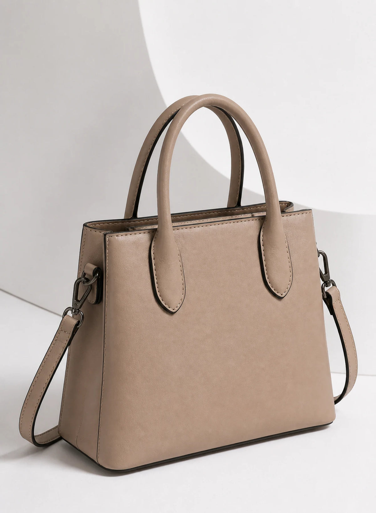 Frame Mini Tote, mini tote bag shown in a complementary studio setting